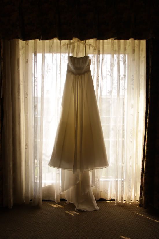 Plano Wedding Photographers 2, wedding dress in window and wedding photography at the Stonebriar Westin and Maggiano's in Plano by wedding photographer Eternal Stories
