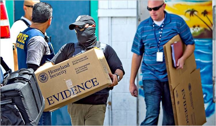 DHS Officers seizing evidence
