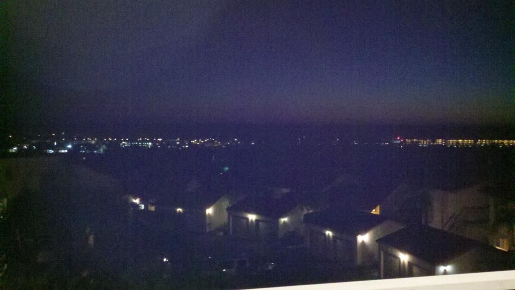 Pacific ocean view from a remodel condo in Carlsbad California Dark view out over the Pacific ocean just after sunset In Carlsbad California